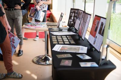 A photo from the 2022 Art Walk, where Carthage students, including graphic design majors, display...